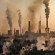 Smoke billows from a large steel plant.